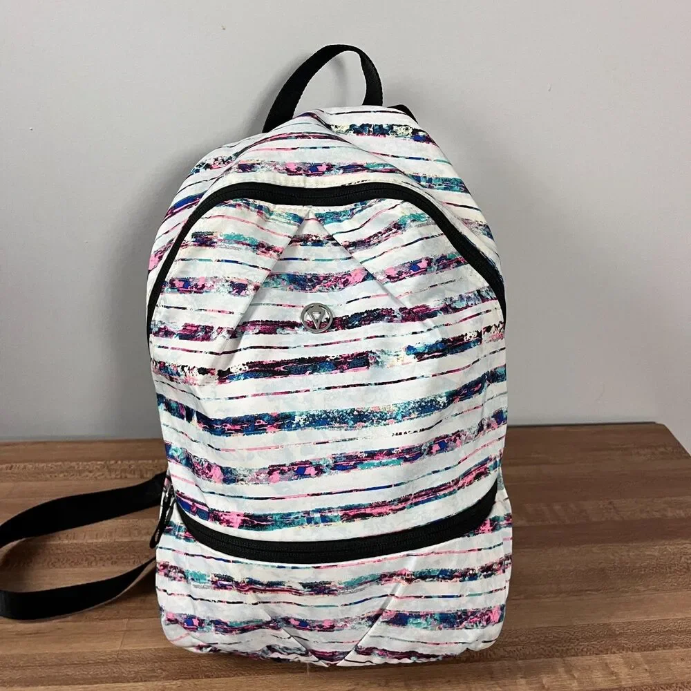 Ivivva by Lululemon Girl's Active Small Backpack Multi Stripe Bottom Shoe Pocket